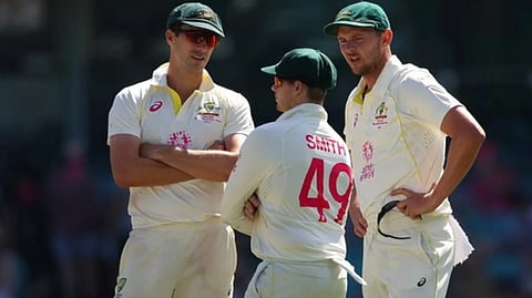Pat Cummins with Steve Smith and Josh Hazlewood