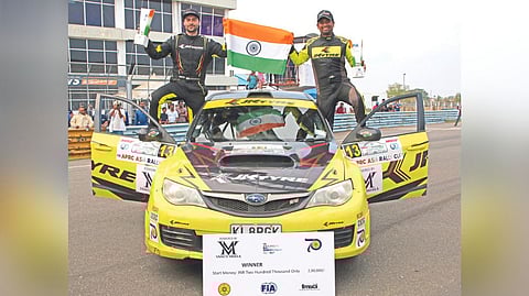 Gaurav Gill (left) and co-driver Aniruddha Rangnekar celebrate their victory in the second round.