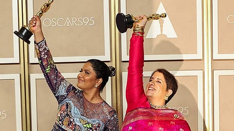 Kartiki Gonsalves (left) with Guneet Monga at the Oscars photo room in Hollywood, Los Angeles