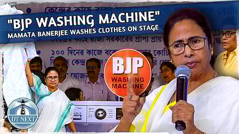 Mamata Banerjee washes clothes on "BJP washing machine"