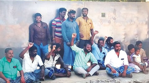Local residents protesting with dead fish in front of a lungi manufacturing firm in Kaveripakkam PU, Ranipet district