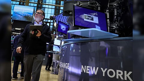 Traders work on the floor of the New York Stock Exchange (NYSE) in New York City