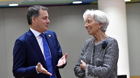 European Central Bank President Christine Lagarde, right, speaks with Belgium's Prime Minister Alexander De Croo during a round table meeting at an EU summit in Brussels