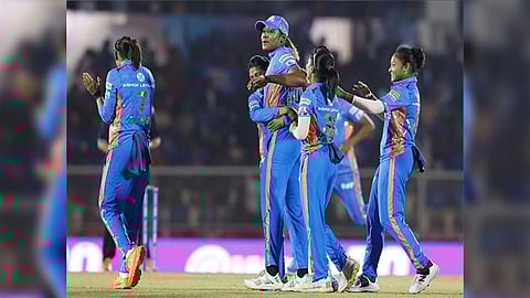 MI players celebrating a wicket