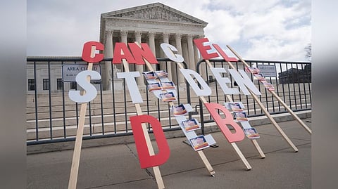 A sign calling for student loan debt relief is seen in front of the Supreme Court as the justices are scheduled to hear oral arguments in two cases involving President Joe Biden's bid to reinstate his plan to cancel billions of dollars in student debt in Washington, U.S., February 28, 2023.