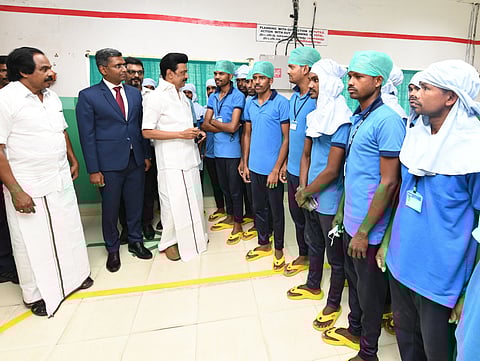 CM Stalin interacting with a group of labourers at a latex unit in Tirunelveli