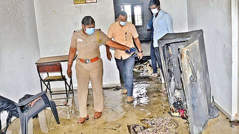 Police inpect the scene of refrigerator blast