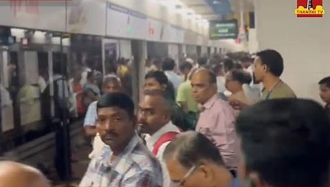 Passengers waiting at the Metro station