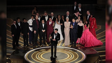 Daniel Kwan, Daniel Scheinert and Jonathan Wang win the Oscar for Best Picture for "Everything Everywhere All at Once" during the Oscars show at the 95th Academy Awards