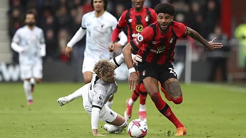 Bournemouth's Philip Billing gets past Liverpool's Harvey Elliott