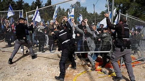Protestors involved in scuffle with security officials