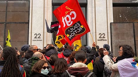 French SNCF workers, members of French CGT and Sud Rail labour unions enter the headquarters of luxury retailer Louis Vuitton during a demonstration in Paris as part of the 12th day of nationwide strikes and protests against French government's pension reform, in Paris