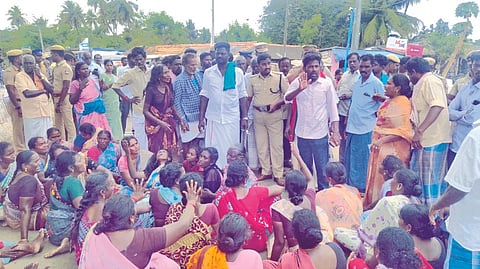 Public and relatives of a worker, who was killed in a group clash over a temple festival, blocked a road