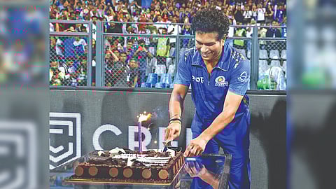 Sachin Tendulkar cuts a cake on Saturday