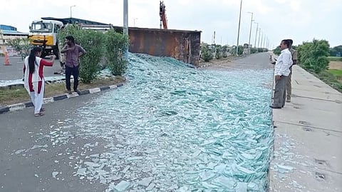 The glass pieces lying on the road