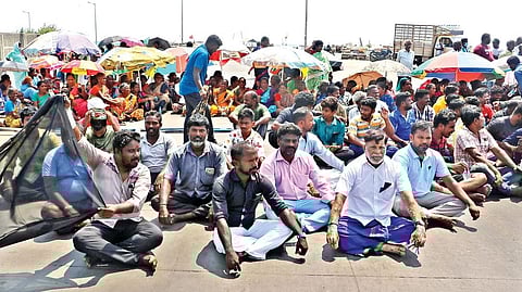 Hundreds of fisherfolk tied black flags on their boats and staged a protest