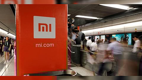 An advertisement for Xiaomi is displayed at a subway station in Hong Kong