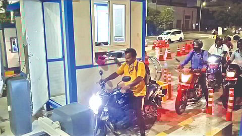 Riders collecting token at the airport entrance