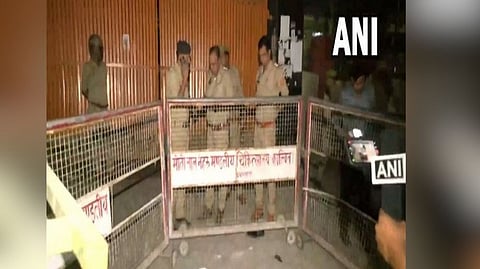 Police personnel at the scene after Atiq Ahmed and Ashraf were shot dead.