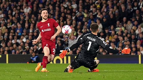 Liverpool?s Diogo Jota, left, scores during the Premier League match between Leeds United and Liverpool FC at Elland Road, Leeds, England.