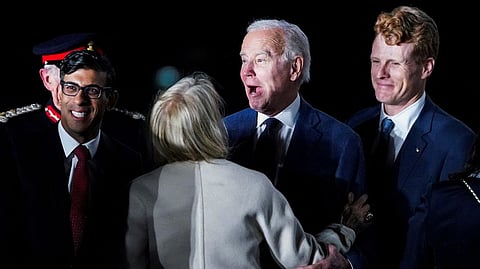 British Prime Minister Rishi Sunak and U.S. Ambassador to the United Kingdom Jane Hartley greet U.S. President Joe Biden next to Joe Kennedy upon Biden's arrival at RAF Aldergrove airbase in County Antrim