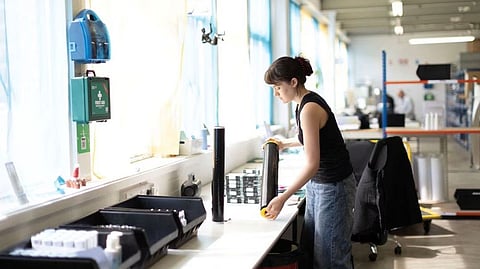 Lilly Ellis, Production Executive works on skincare products at 5 Squirrels, a skincare company, in Hove, Britain April 18, 2023. REUTERS/Anna Gordon
