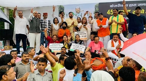 Former Union Health Minister Dr Harsh Vardhan with others party workers stage a protest against Delhi CM Arvind Kejriwal outside CM's residence over the renovation row