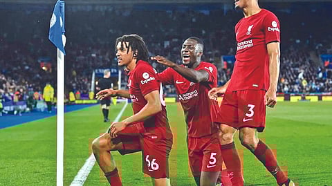 Liverpool players celebrate their 3-0 win over Leicester City