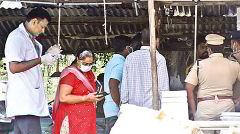 Forensic experts investigating the Tasmac outlet and the bar in Thanjavur on Tuesday