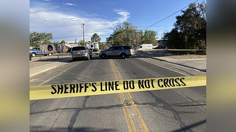 Law enforcement officers cordon off roads