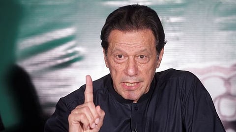 Pakistan's former Prime Minister Imran Khan, gestures as he speaks to the members of the media at his residence in Lahore, Pakistan