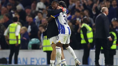 Brighton & Hove Albion's Pervis Estupinan with Julio Enciso celebrate qualifying