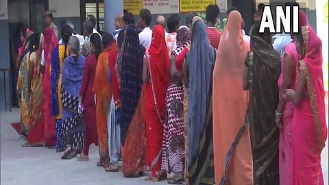 Voters queued up at a polling booth in Azamgarh