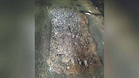 Highly damaged Tiruvottiyur service road in Old Washermenpet