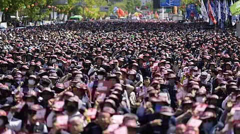 Members of the Korean Confederation of Trade Unions shout slogans during a rally on May Day in Seoul, South Korea, Monday, May 1, 2023.