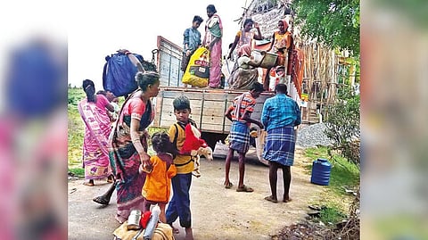 Bonded labourers on open truck
