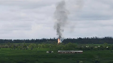 Fire and smoke raise after artillery shelling near Bakhmut, an eastern city where fierce battles between Ukrainian and Russian forces have been taking place, in the Donetsk region, Ukraine