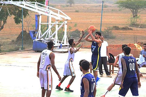 India player Muin Bek in action against MLR Hyderabad in the All-India basketball tournament