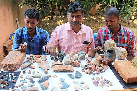 Rajaguru with the artefacts discovered in Peraiyur