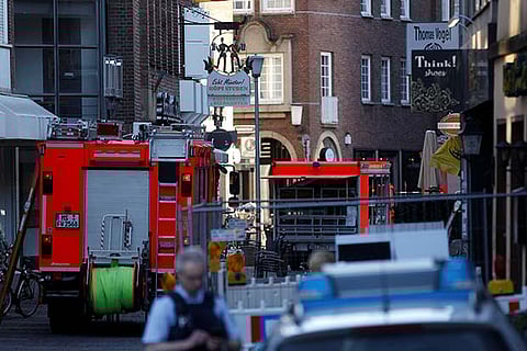 Police vehicles and fire engines near a place where a man drove a van into a group of people
