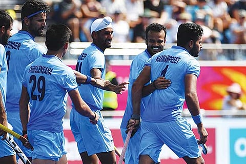Indian players celebrate the opening goal of Harmanpreet Singh (extreme right) against Malaysia