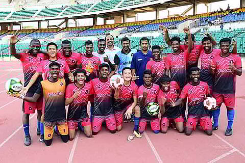 Indian Bank team members pose after winning the CFA Senior Division football league title