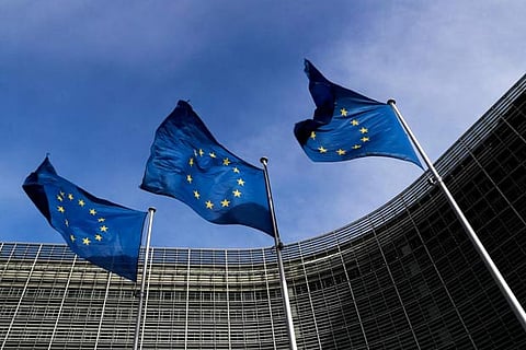 European Union flags flutter outside the EU Commission headquarters in Brussels, Belgium