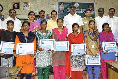 Minister KC Veeramani with the winners of various competitions, in Vellore
