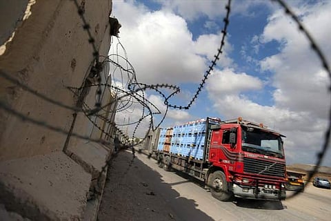 A truck carrying goods arrives at Kerem Shalom crossing in Rafah