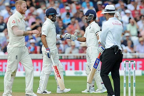 Indian skipper Virat Kohli and Ajinkya Rahane encourage each other during the third test match