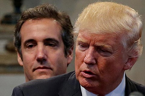 Michael Cohen stands behind US President Donald Trump.(File photo)
