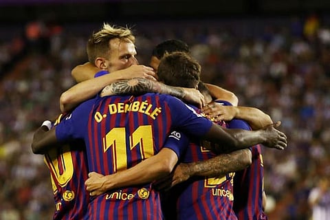 Barcelona's Ousmane Dembele celebrates with team mates after scoring their first goal
