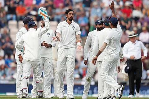 Ishant Sharma celebrates taking the wicket of Adil Rashid
