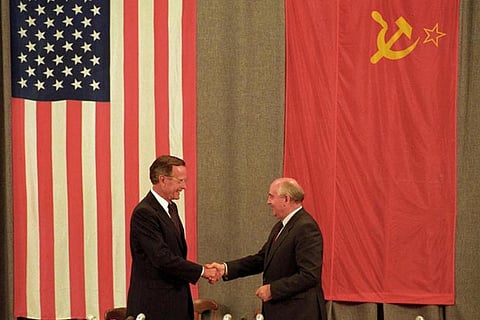 (File Photo) US President George HW Bush, Soviet President Mikhail Gorbachev shake hands in 1991